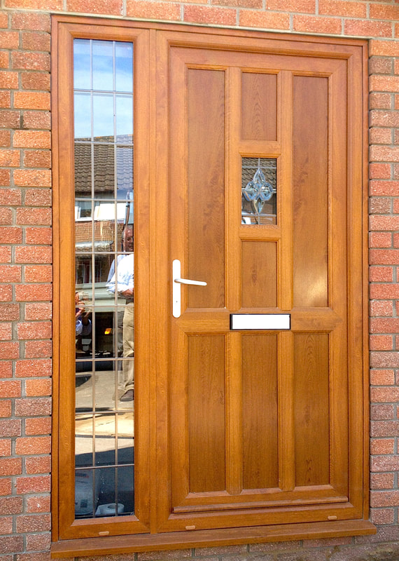 Oak colour uPVC entrance door and sidelight fitted