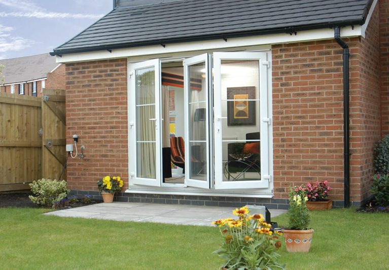 External shote of white uPVC bi-fold door