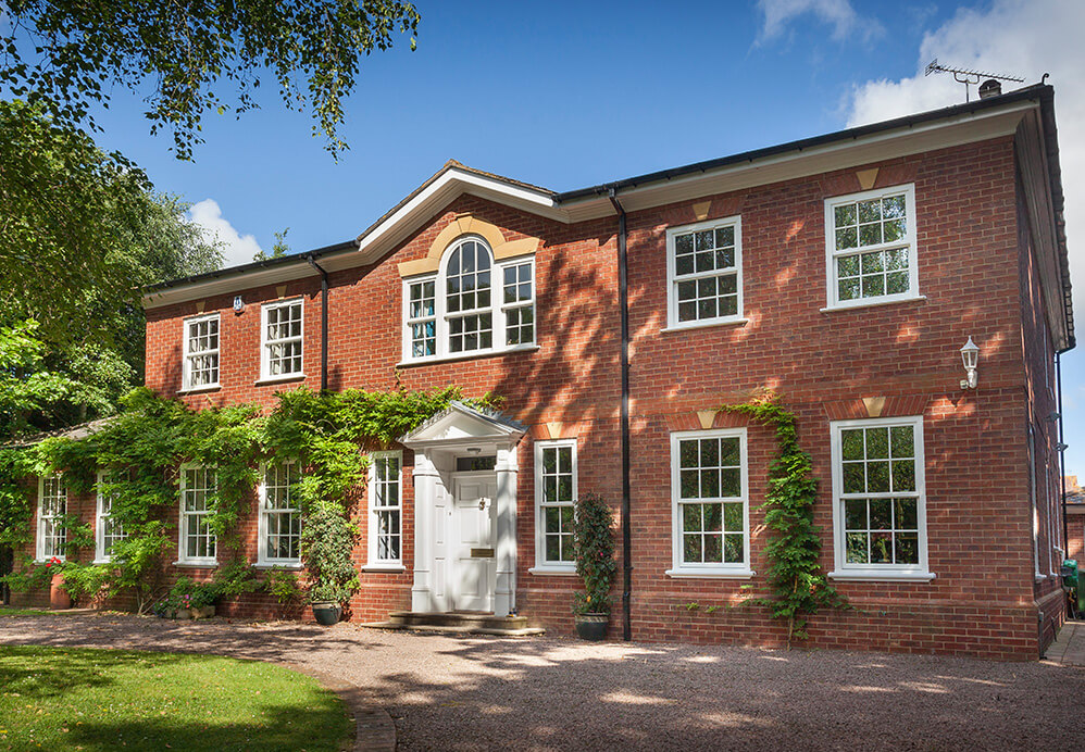 uPVC sliding sash windows with astragal bars