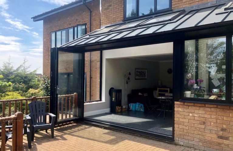 Double glazed folding doors the open up fully