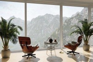 Large span of double glazed windows with a view of mountains