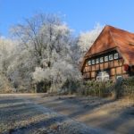 Wintery scene with large house