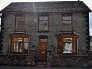traditional cottage with golden oak upvc windows