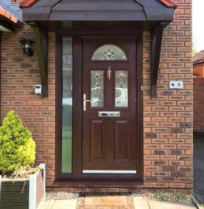 A more traditional style front door with arched window