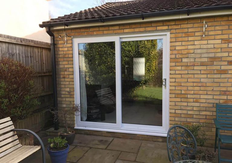 A double glazed sliding patio door that leads out onto the patio