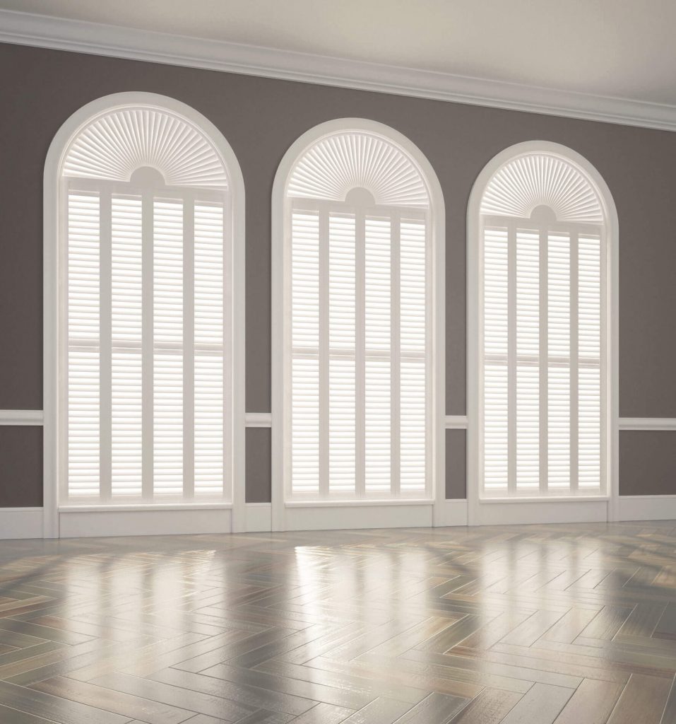 Large arched windows with shutters