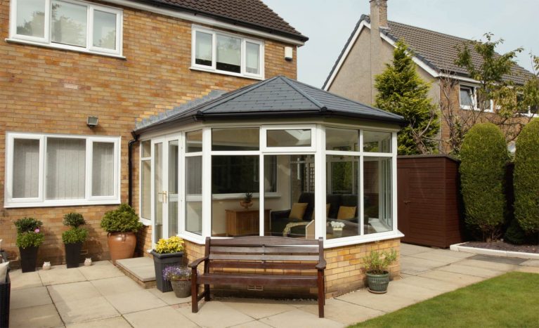A conservatory with a tiled roof