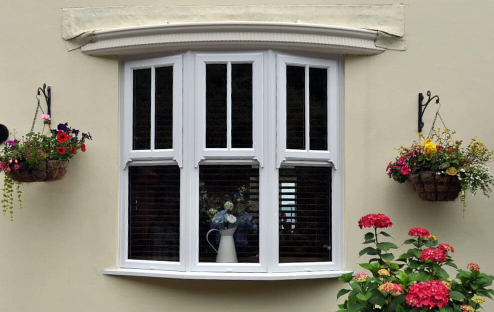 White bow windows with mock sash detail