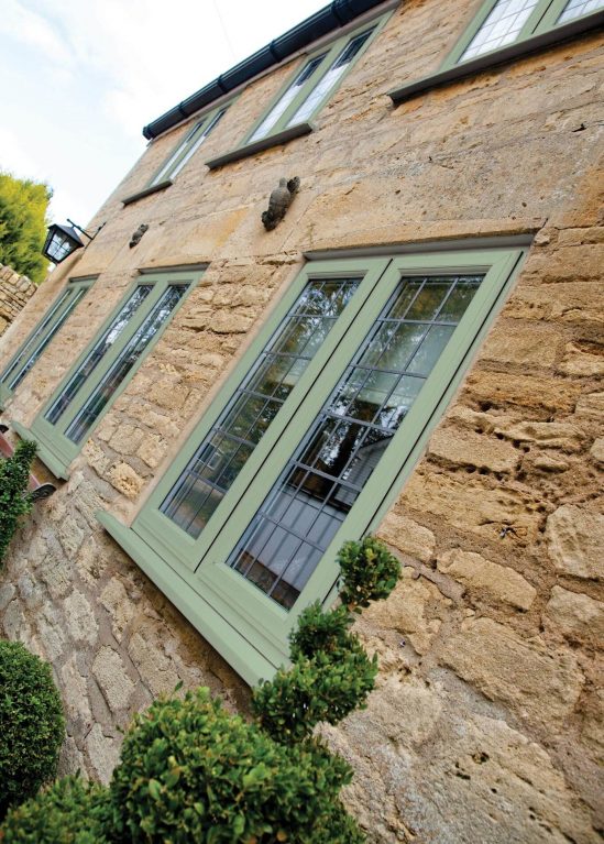 Double glazed windows in green with lead detail