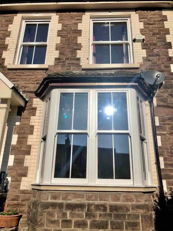 Sash windows in green