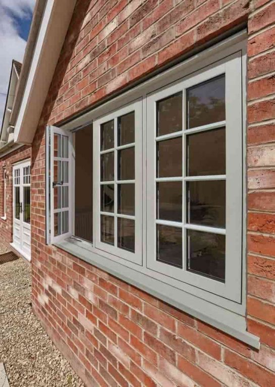 Green coloured windows won a red traditional style property