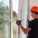 Repair men carrying out repairs on a window