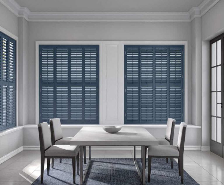 Dining room with blue window shutters fitted
