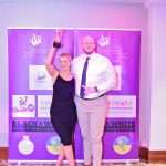man and women winning award