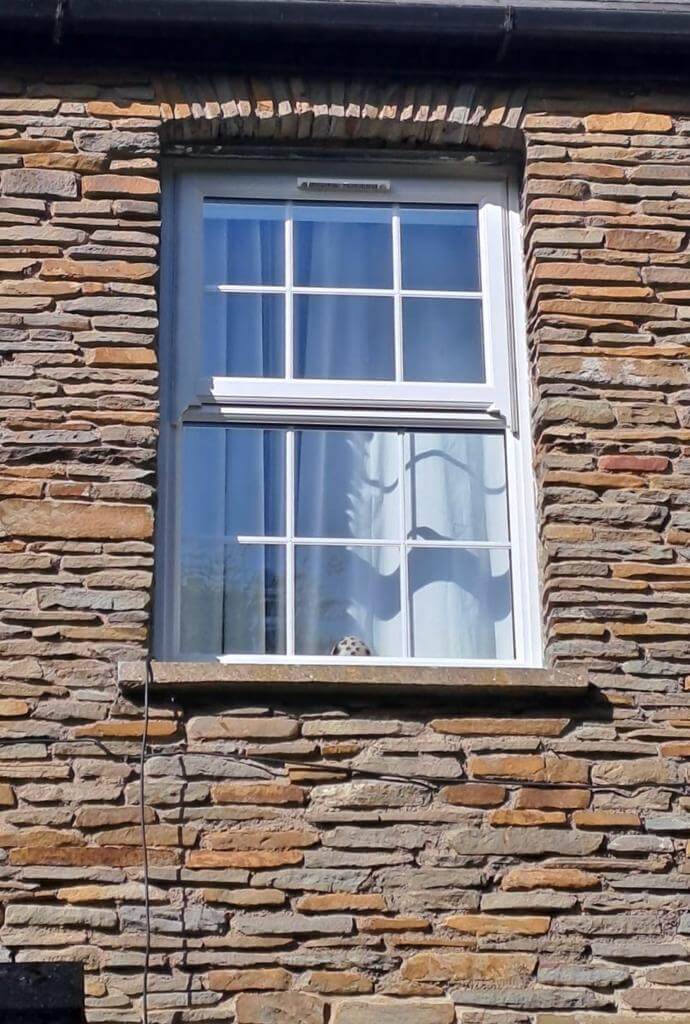 white upvc mock box sash casement windows with a georgian grid