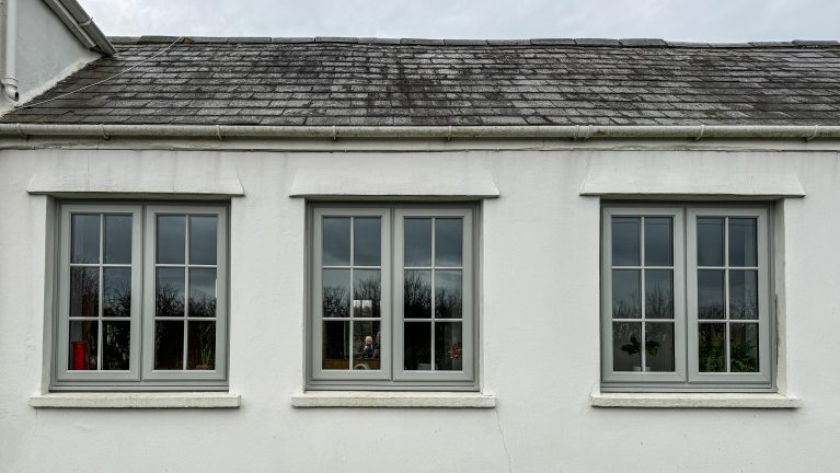 Rehau pearl grey casement windows, with dummy sashes and astragal bars, with pearl grey endurance composite doors