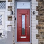 Endurance Fuji composite door with graphite glass, elephant grey frame, rich red door slab.
