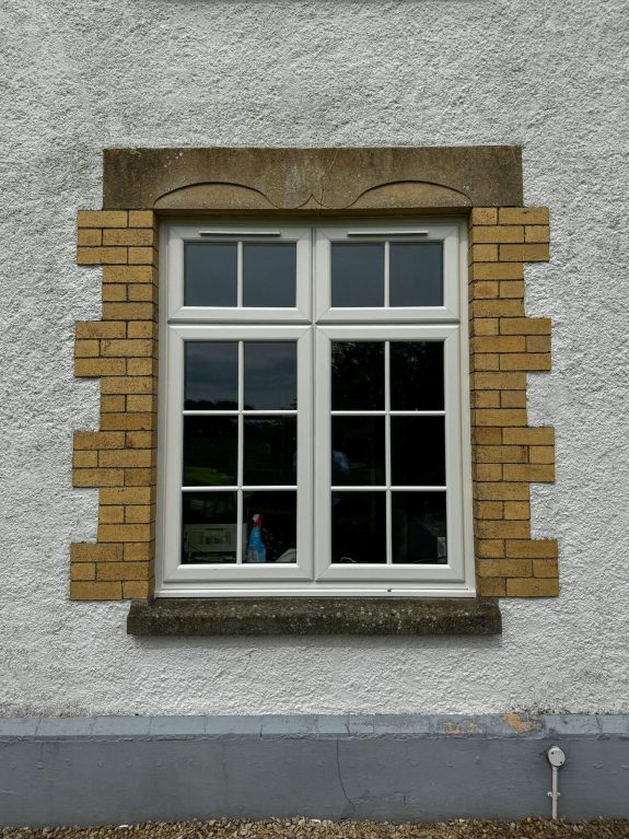 Rehau white grained upvc casement windows with astragal bar
