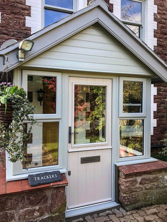 Endurance composite door in claystown with a pearl grey frame with pearl grey rehau windows