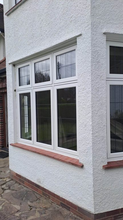 Rehau Rio flush sash windows In white with Georgian lead