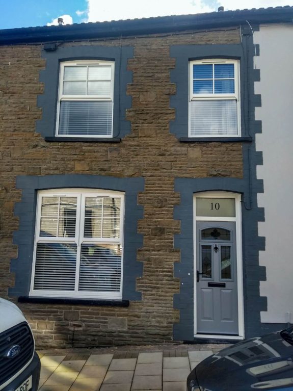 Rehau white upvc mock box sash windows with an endurance hope composite door